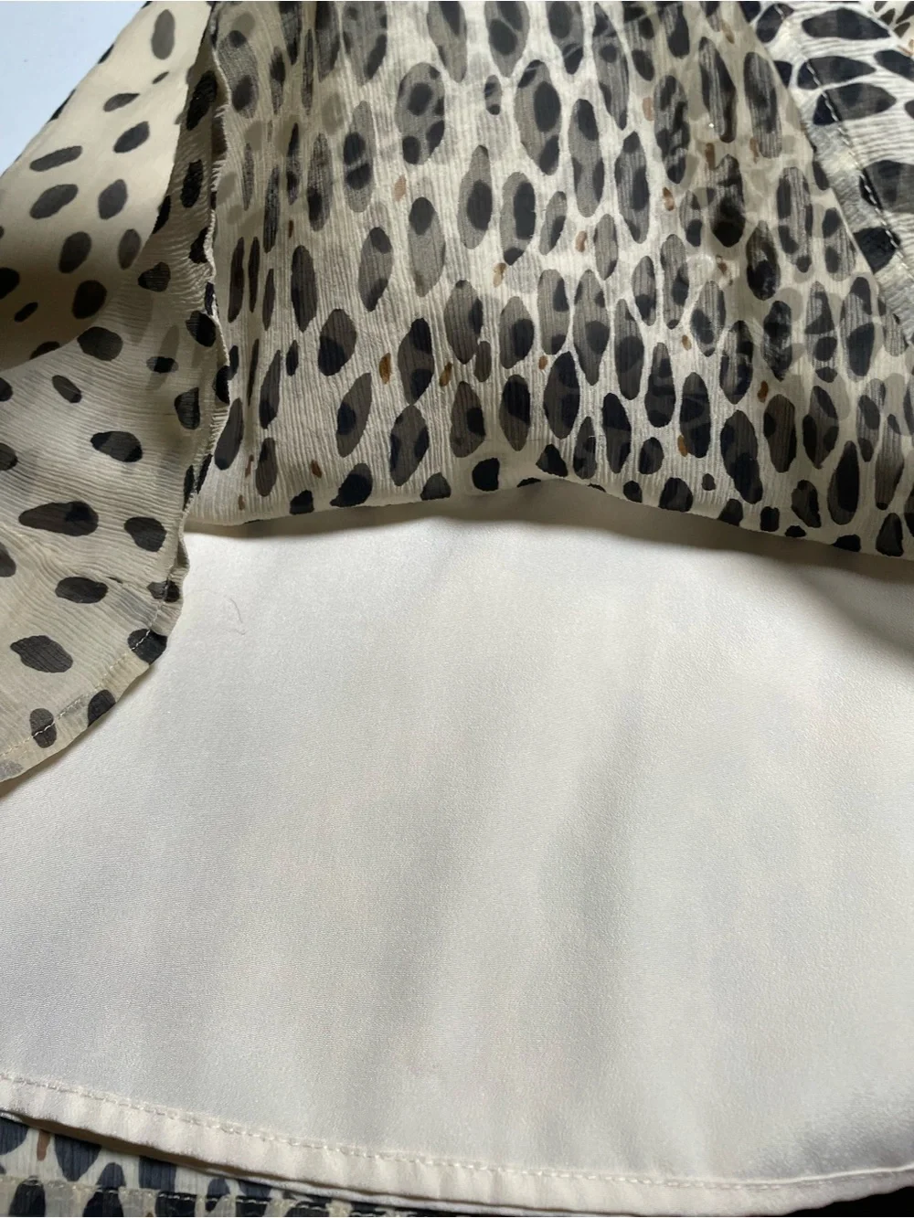 J.Crew silk blouse features a sleeveless design and a cheetah print. Size 2.